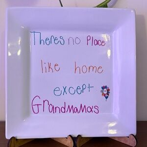 Decorative White Plate with Colorful Text
